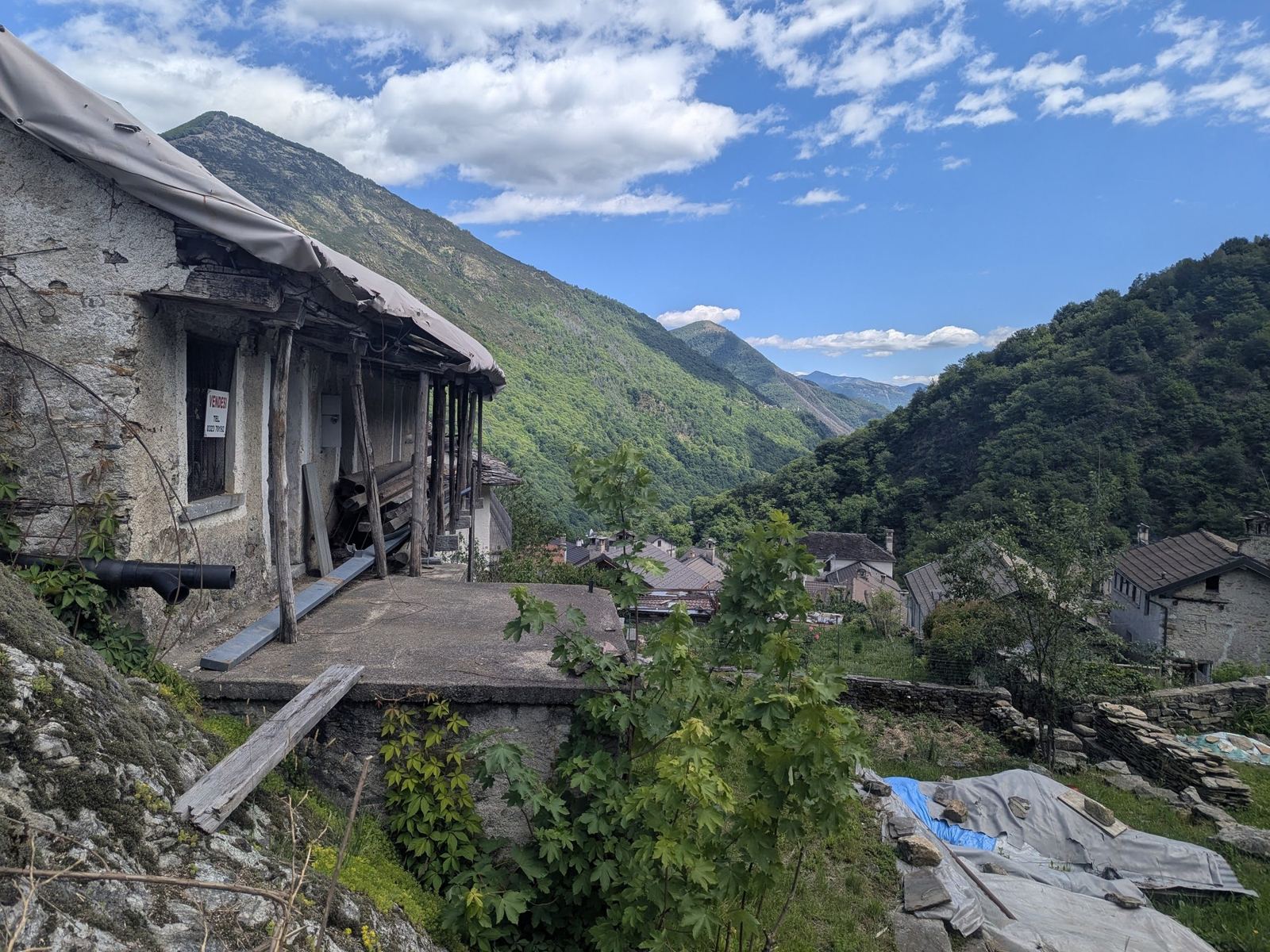 The Valle Cannobina from Crealla, stone houses in the foreground and wooded mountains beyond
