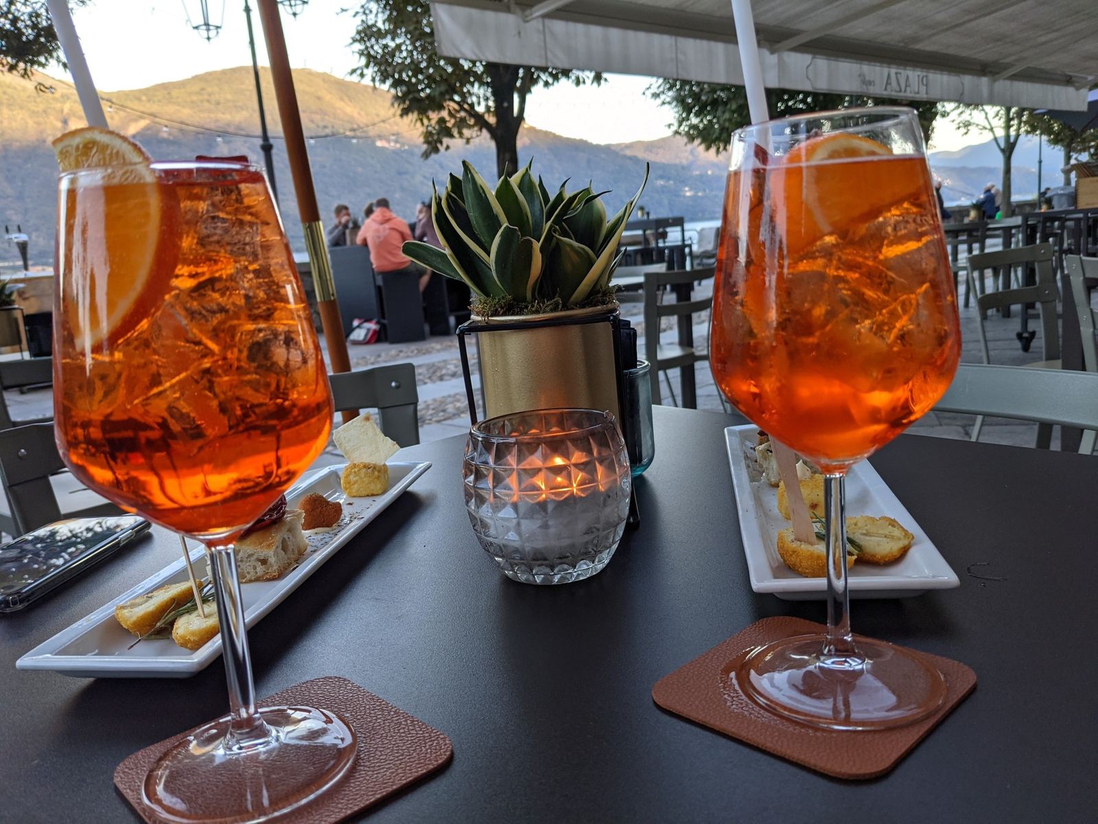 Two spritzes on a café table beside the lake at Cannobio