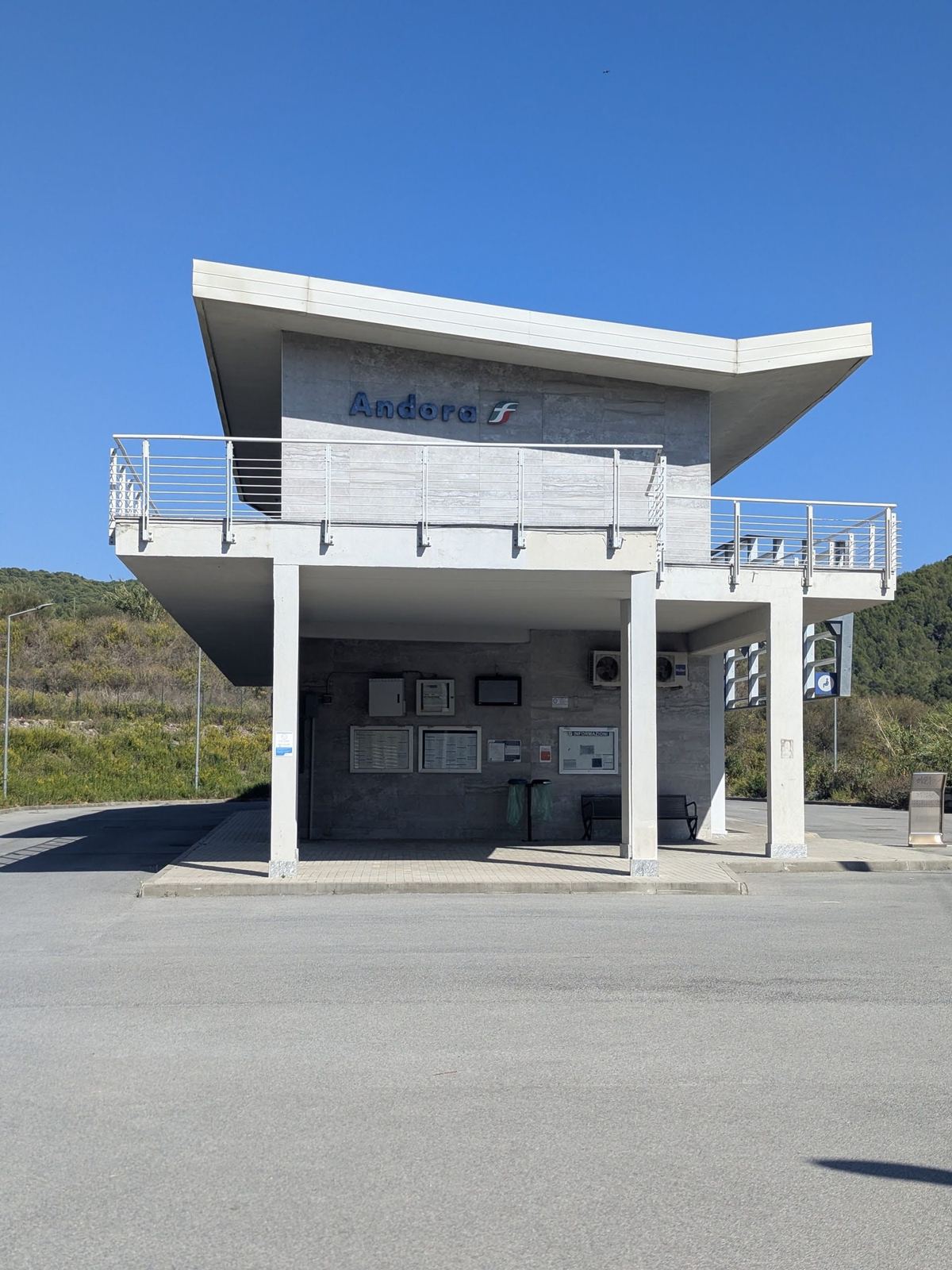 A modern white lookout building on stilts beside the coast path at Andora