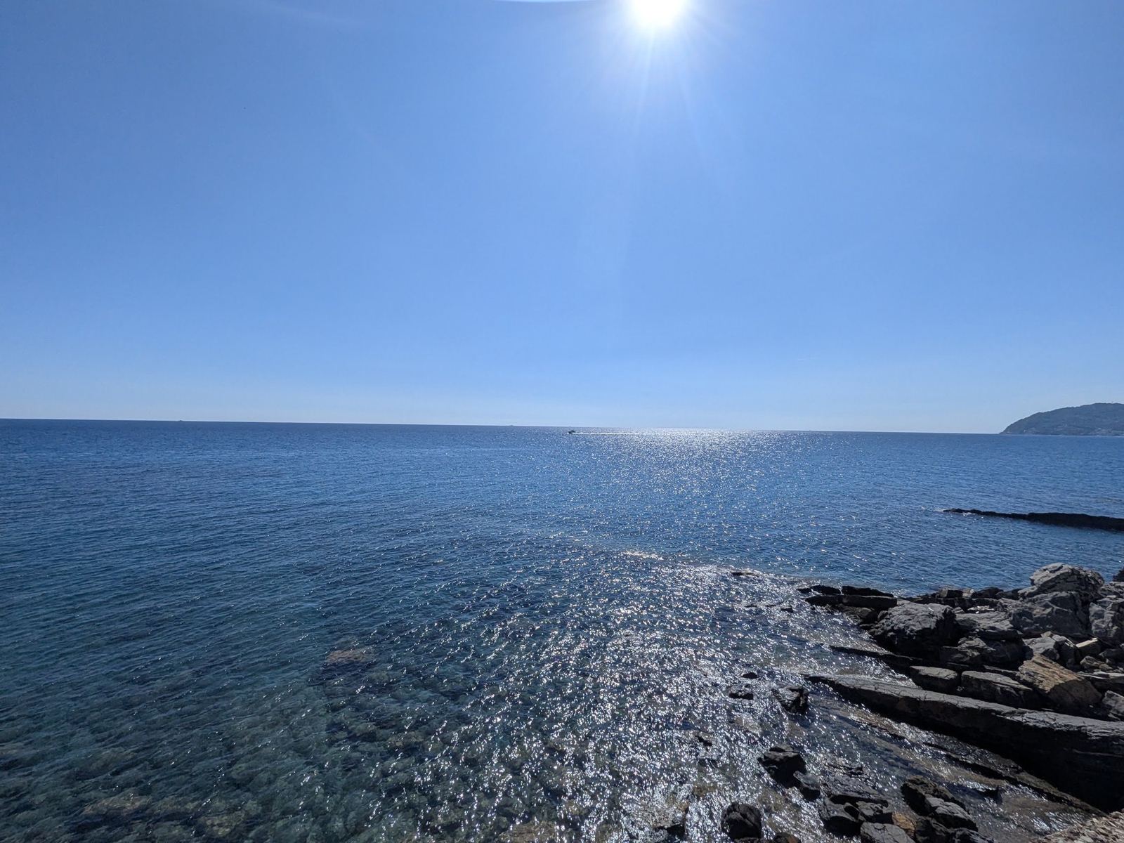 The sea glittering in the sun from the coast near Cervo