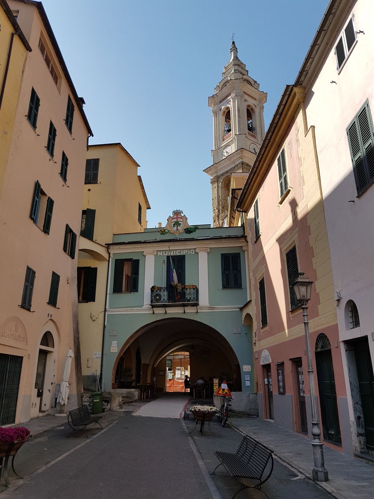 The church of Dolcedo with its tower above the village houses