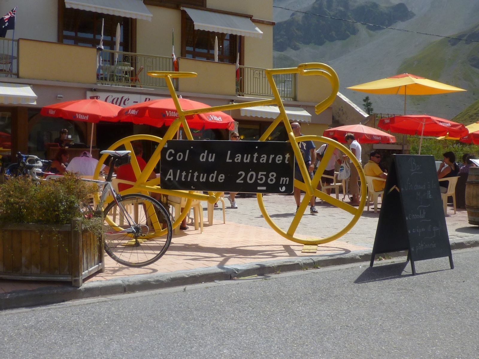 A giant yellow bicycle sculpture at the Col du Lautaret café, altitude 2058m
