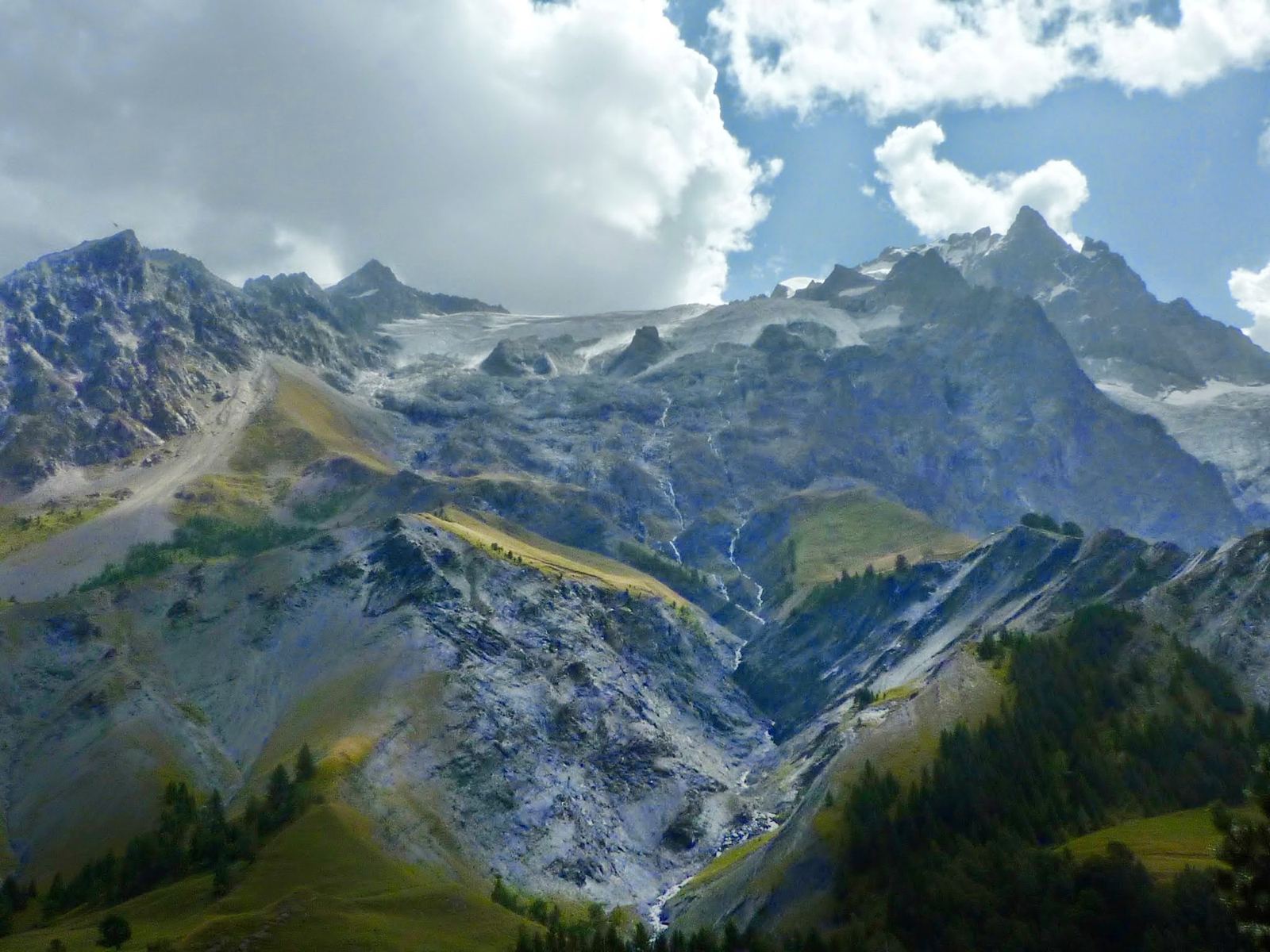 Jagged snow-streaked mountains above the Romanche valley