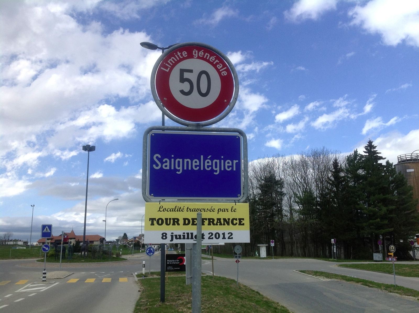 The Saignelégier town sign with a banner announcing the Tour de France on 8 July 2012
