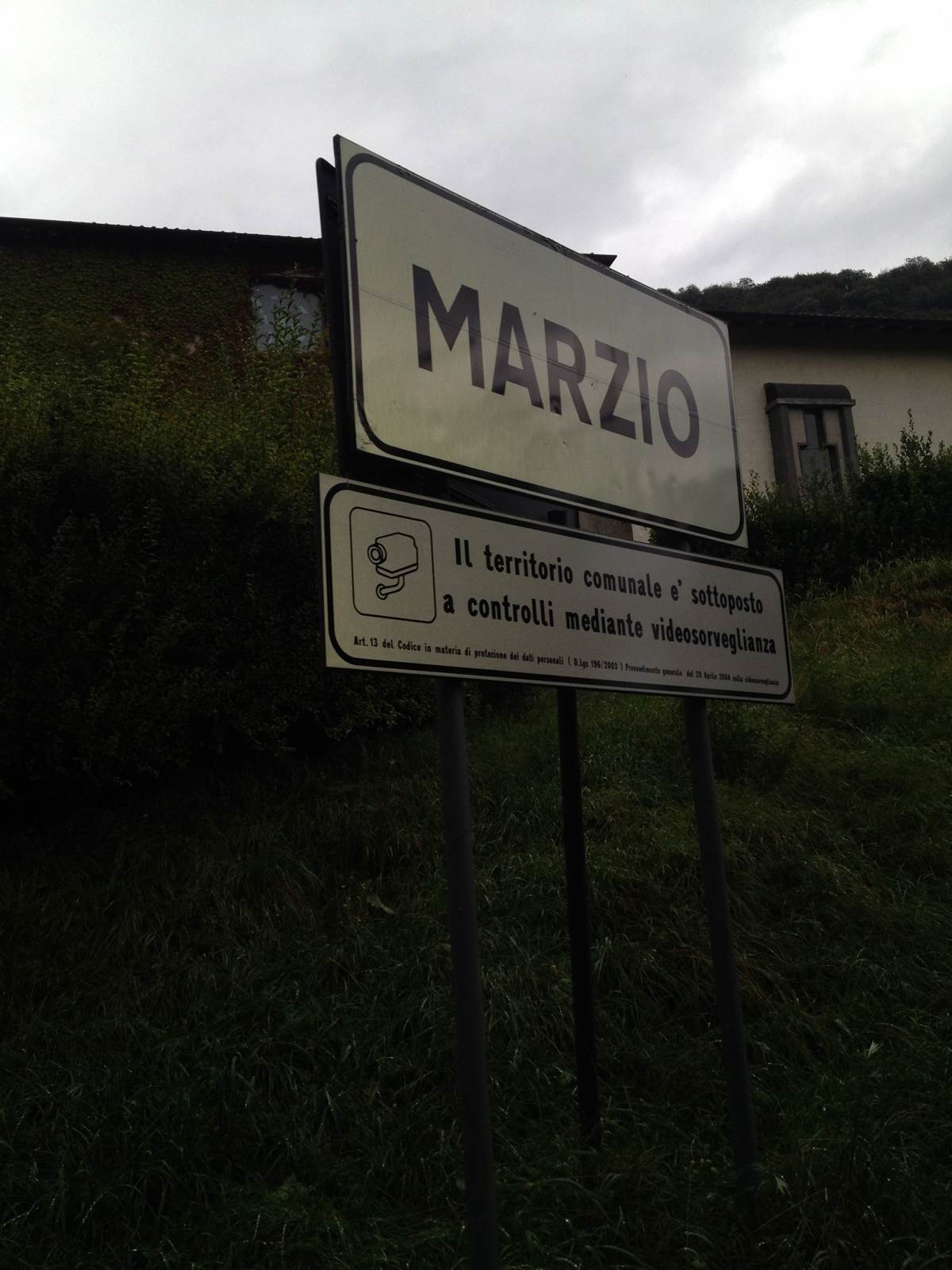 A road sign for Marzio in the hills above Lake Lugano